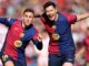 Footballers jubilant after scoring.