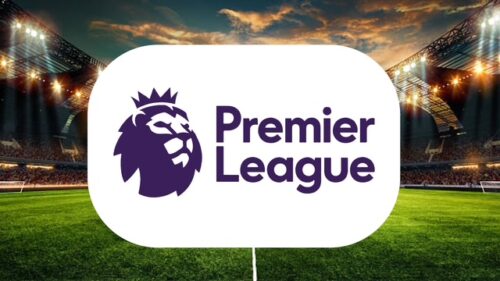 Logo de la Premier League sur un stade illuminé.